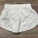 Nike standard Fit Women's White Shorts are a size XS. Photo 4