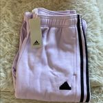 Adidas NWT


Women's Tiro Cut 3-Stripes Fleece
Joggers Photo 4
