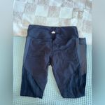 Alo Yoga Vitality Leggings in black with contoured performance lace panels Photo 5