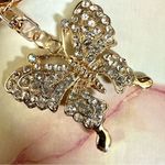 Gold tone butterfly rhinestone hang tag/keychain Photo 1