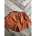 Alphalete  Woman’s Infinity Stride Short W/ Liner - Sour Tangerine, Size Small Photo 4