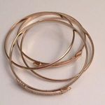 5 FOR $25 Set of 4 gold arrow bangles. Photo 0