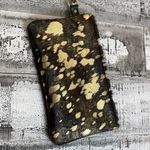 Metallic leather acid wash black and gold wristlet With removable strap. Photo 2