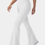 Halara 143H.- Crossover High Waisted Back Pocket Super Flare Leggings. Photo 0