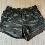 Athleta Athletes racer run shorts 4” Photo 1