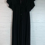 Get ready for the perfect beach party in this ruffle cover up. has an attracted deep V Photo 0