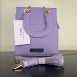 Trina Turk double handle tote in lilac with a removable crossbody strap Photo 4