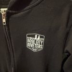 Women’s Rose City Riveters Black Zip Up Hoodie Size Medium Photo 1