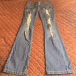 L.A. Idol Low Rise Distressed Flare Jeans Blue Size undefined Photo 0