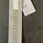 Lululemon  Gray and Gold Never Lost Keychain Photo 0