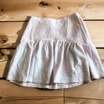 Nordstrom NSR STRIPE SMOCKED WAIST SKIRT IN PERI SIZE M NWT REG$35. Stretchy smocking brings comfort to a classic striped skirt that brings swishy movement to your ensemble. 15" length Elastic waist 68% polyester, 30% cotton, 2% spandex Hand wash, line dry Imported Model Stats: 5'10" height; 34" bust; 27" waist; 35" hips. Photo 3