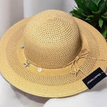 Tan Sun Hat with Wide Brim and Decorative Band Photo 0