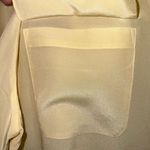 Jaclyn Smith  Light Yellow Blouse Photo 2