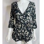 Free People All the Right Ruffles Romper in Raven Combo Button Back 3/4 … Photo 7