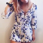 B. Original Blue Floral Lace Up Romper size small Photo 0