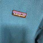 Patagonia ! Teal blue green fleece quarter zip sweater and a women’s size xsmall! Photo 1