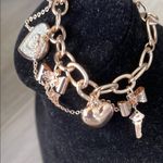 Guess Gold and Silver Charm Bracelet with Heart Photo 1
