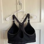 Under Armour  black front zip compression sports bra size 40DDD Photo 3