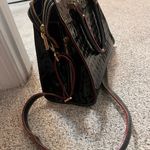 Like New Arcadia Black Leather Handbag with Red Accents. Photo 6