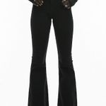 Topshop Petite Jamie flare jeans in black Photo 2