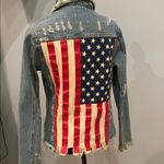 Unif Distressed Denim Jacket with Studs  brand xs American flag on back Photo 1