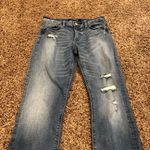 EXPRESS Skinny Mid Rise Distressed Jeans Photo 1