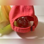 Nike  Women's Caps in Coral and Pale Yellow Photo 4