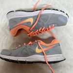 Nike  Revolution Women's Athletic Shoes Gray and Orange Photo 0