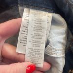 Good American Distressed Boot Cut Jeans Photo 3