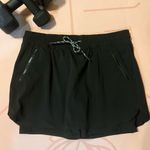 Athleta  Black Trekkie Active Skirt Workout‎ Zipper Pockets Drawstring Women's 10 Photo 1