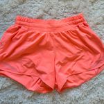 Lululemon bright coral shorts 4’ Photo 0
