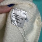 Ivory Short Sleeve V Neck Puff Sleeve a sweater top White Photo 1