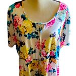 Torrid NWT- Stunning white with bright colorful flowers, babydoll style, ties in front, flutter sleeves, lightweight, the perfect summer top, brand new, size 2x Measurements: Bust: armpit to armpit 25 inches Waist: side to side 22-27 inches Length: shoulder seam to bottom 30 inches Photo 1