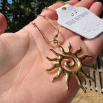 Gold sun swirl necklace Photo 2