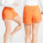 Athleta Mesh Racer Run Mid Rise 4” Shorts Pull On Running in Orange Size XXS Photo 1