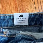 PacSun Medium to dark wash jean shorts with some rips. Photo 2