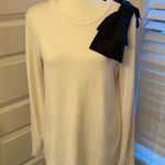 Halogen || White long sleeve top with black bow on shoulder. Photo 0