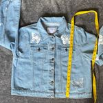 The Style Between Us Women's Light Blue Denim Jacket with Butterfly Embroidery Photo 9