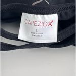 Capezio  black tank top with cut out design on back. Size large child Photo 4