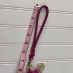 Adrienne Vittadini Pink Wristlet with Built-in Phone Charging Bank Photo 12