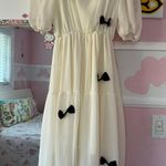 white dress with black bows Photo 2