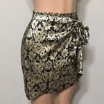 NBD gold and black high waisted faux wrap shirt. Photo 2