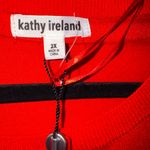 Kathy Ireland  Red Sweater Photo 1