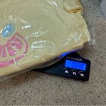 White Fox Boutique Give Up All My Time Baby Tee in Lemon (Yellow) and size small Photo 11