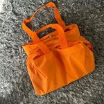 Baggallini  orange carry all nylon tote large with pink lining Photo 0