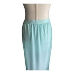Divided H&M -MAXI SKIRT-SIZE 4 Gorgeous mint green skirt, mini skirt with a sheer maxi overlay, elastic waist, slits on both sides of the skirt, excellent condition Measurements: Waist: side to side 13-17 inches Length: mini skirt Waistband to bottom 13 inches Length: overlay skirt Waistband to bottom 41 1/2 inches Photo 5