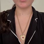 Vintage gold heart shaped necklace with evil eye detail and red stone in center Photo 2