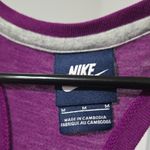 Nike  Women's Purple Tank Top with Yellow Logo Photo 1