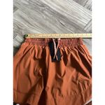 Alphalete  Woman’s Infinity Stride Short W/ Liner - Sour Tangerine, Size Small Photo 9