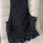 Women size small Black Jean romper overall short with distressed hem and areas Photo 1